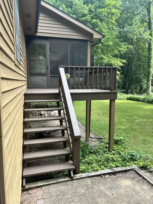 Painted deck stairs and screened porch